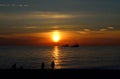 Sunset on the Black Sea with people on the shore