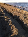 Sunset at Black and White Sand Beach with Reef in Winter in Kekaha on Kauai Island, Hawaii - Niihau Island in Horizon. Royalty Free Stock Photo