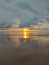 sunset blocked by clouds on the beach