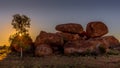 Sunset on blocks of stone rounded by erosion, Devil`s marbles also called Karlu Karlu in aboriginal language