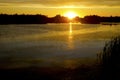 Sunset in blue green algae lake water in many shades and colors