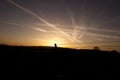 Sunset and blue sky background and plane traces.