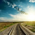 Sunset in blue sky over railroad Royalty Free Stock Photo