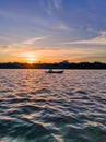 sunset and a boat on the Kapuas River Royalty Free Stock Photo