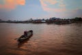 Sunset. Boat in river Kahayan Palangka Raya city