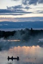 Sunset, boat and smoke Royalty Free Stock Photo