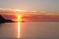 Sunset with boat and sun at Fannie bay