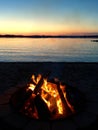 Sunset bonfire on the beach at Chippewa Lake, Michigan. Royalty Free Stock Photo