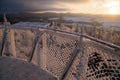 sunset at Borowa Gora view point during winter time. Frosty structure, glazed, icy branches and net fence. Royalty Free Stock Photo