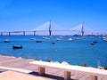 Sunset on the bridge of La Constitucion, called La Pepa, with boat sea in Cadiz, Andalusia. Spain