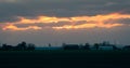 Sunset with bright silver lining at the edge of the clouds Royalty Free Stock Photo