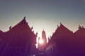 Sunset at buddhist building, silhouette of the chapel and pagoda Royalty Free Stock Photo