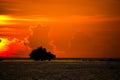 Sunset with burning vibrant yellow and red glowing cumulonimbus towering vertical clouds on Phuket, Thailand Royalty Free Stock Photo