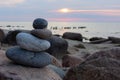 Sunset cairn at baltic sea beach