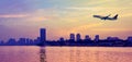 Sunset at Cairo city with passenger airplane over Nile river Royalty Free Stock Photo