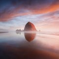 The Sunset at Cannon Beach with Dramatic clouds in the background and a nice reflection in water. Dramatic coastal seascape. Royalty Free Stock Photo