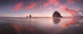 The Sunset at Cannon Beach with Dramatic clouds in the background and a nice reflection in water. Dramatic coastal seascape. Royalty Free Stock Photo