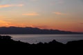 The sunset at the Cap de Creus in the photo Llanca and the Port