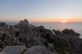 Sunset at the Capotesta Lighthouse in Sardinia Royalty Free Stock Photo