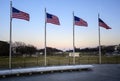 Sunset captured behind the circle of flags at the Washington Monument Royalty Free Stock Photo