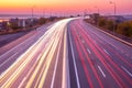 Sunset Car Traffic With Light Trails on a Suburban Highway Royalty Free Stock Photo
