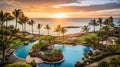 Sunset casts a tranquil glow over a Hawaiian resort, with its infinity pool blending into the sea Royalty Free Stock Photo