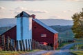 Sunset at Cattle Farm + Red Barn with American Flag - West Virginia Royalty Free Stock Photo