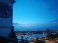 Sunset caught from the clock tower above the city. Gorgeous city lights, bridge, river, skyline and architecture. Travel the world Royalty Free Stock Photo