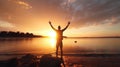 Sunset Celebration: Joyful Man with Arms Raised on Beach - Expressing Freedom and Happiness at Sunset - Tranquil Sunrise Scene, We Royalty Free Stock Photo