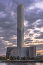 Sunset on the chimney of port cleaning plant in the Odaiba Bay industrial harbor in front of the Rainbow Bridge in Tokyo