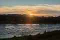 Sunset on a choppy river wind early spring landscape Royalty Free Stock Photo