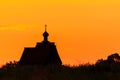 Sunset church cross silhouette in sunset sky clouds. Sunset church silhouette