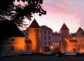 Sunset in the city evening medieval old town of Tallinn towers park at night city light bench trees sky Royalty Free Stock Photo
