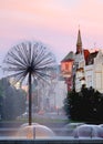 Sunset, city of Kolobrzeg, colorful fountain, park, cathedral, urban architecture.