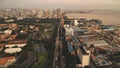 Sunset cityscape with designed park and ponds at ocean bay aerial. Port town of Manila at summer