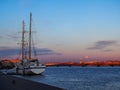 Sunset cityscape with old sailing ship Royalty Free Stock Photo