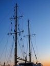 Sunset cityscape with old sailing ship Royalty Free Stock Photo