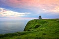 Sunset at the Cliffs of Moher with O`Brien`s Tower, Ireland Royalty Free Stock Photo