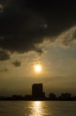 Sunset and Cloud over the building city with silhouette and reflection Royalty Free Stock Photo