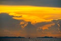 sunset cloud on silhouette sky fishing boat on sea and island