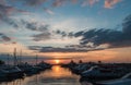 Sunset with cloud sky on the pier with yachts