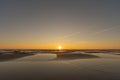 Sunset in a cloudless sky on the coast of the Gulf of Finland i