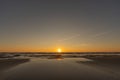 Sunset in a cloudless sky on the coast of the Gulf of Finland in Ust-Narva.