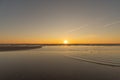 Sunset in a cloudless sky on the coast of the Gulf of Finland in Ust-Narva.