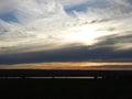 Sunset clouds lay lengthwise over Cayuga Lake in the FingerLakes