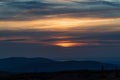 Sunset with clouds and colorful sky from Snezne jamy in Krkonose mountains on czech - polish borders Royalty Free Stock Photo