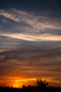 Sunset with clouds of golden colors during the fall of the sun Royalty Free Stock Photo