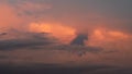 A beautiful yellow, red, orange and blue sunset in the clouds over Curitiba, Brazil with black clouds Royalty Free Stock Photo