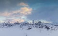 Sunset Clouds over Pasture Fields Fence Covered in Snow Royalty Free Stock Photo