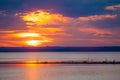 Sunset in clouds over water Royalty Free Stock Photo